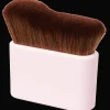 Action Brosse pour autobronzant* Maquillage